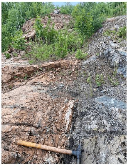 Field outcrop showing quartz veining and shearing